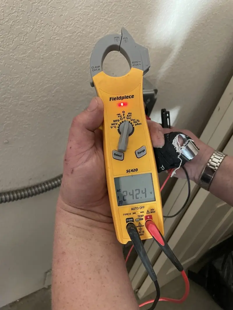Voltage testing with clamp meter during Aluminum Wiring Replacement in Germantown